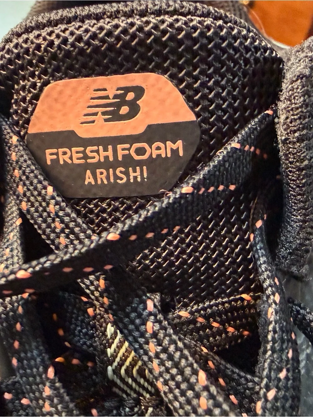 New Balance Kids Black Sneakers with orange/teal Accent